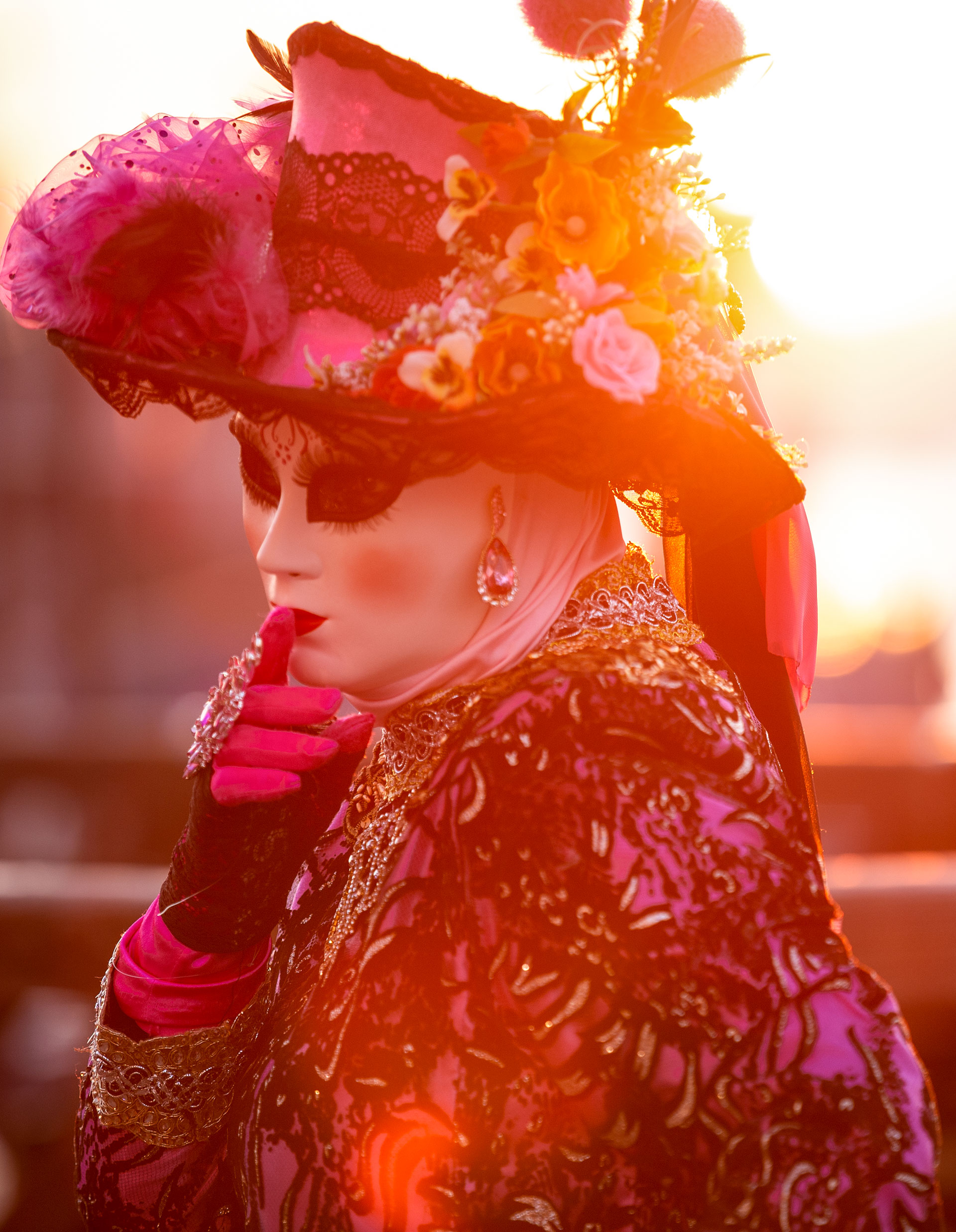 A reveller wearing a mask and a period costume takes part in the Venice Carnival on February 15, 2020-Laura Venezia