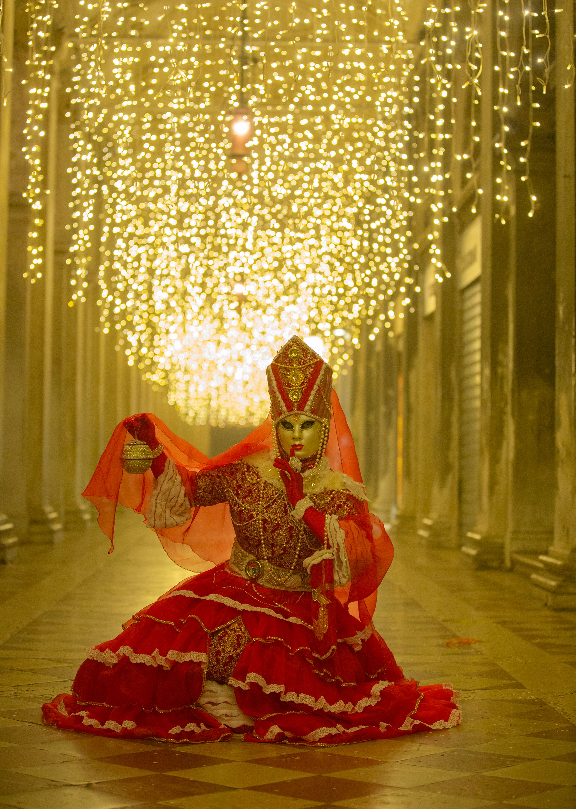 A reveller wearing a mask and a period costume takes part in the Venice Carnival on February 15, 2020- Laura Venezia